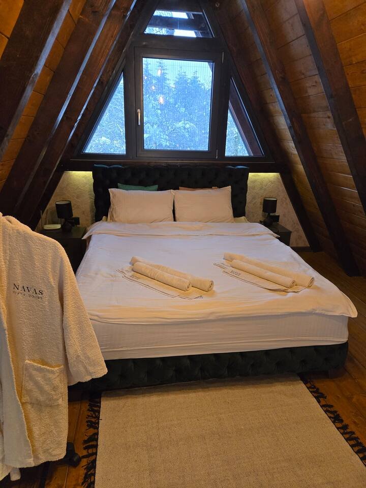 Dining area with elegant chandelier and table setting