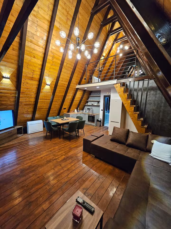 Wide view of illuminated garden path with string lights