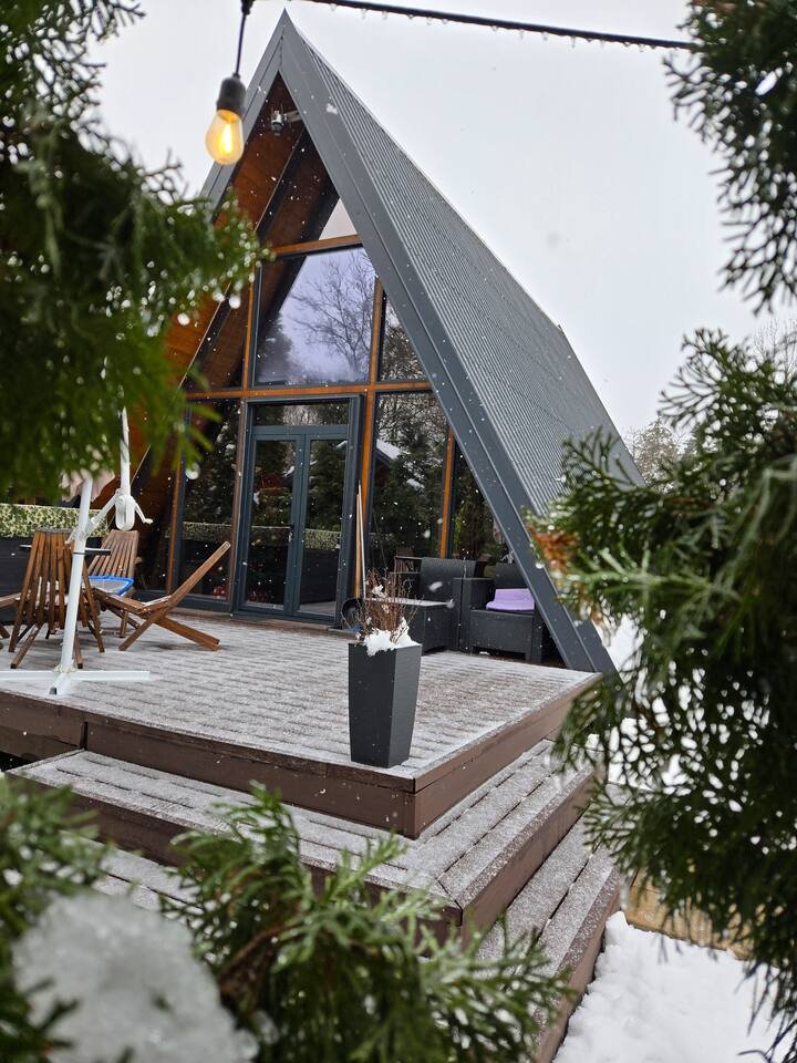A-frame side view in deep winter snow